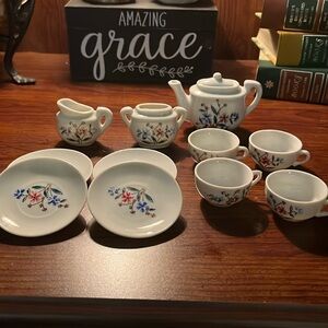 Vintage china toy tea set. 12 pieces no damage. Box is damaged from storage.
